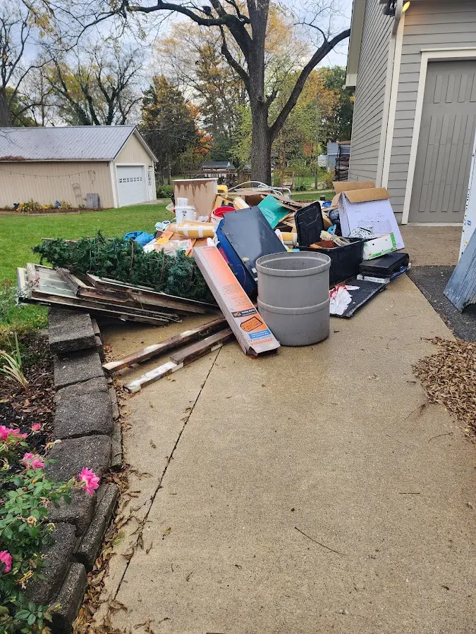 Dumpster being loaded with debris for 12 Yard Dumpster Rental in Salida del Sol Estates